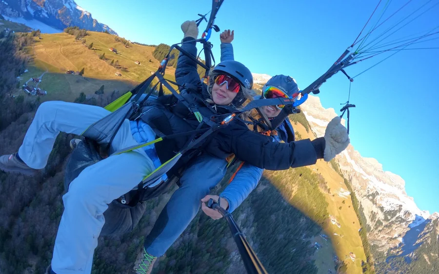 A tandem paraglider above Lake Lucerne