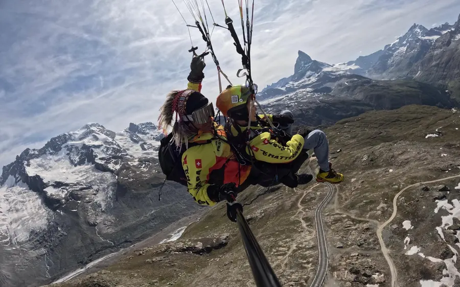 A tandem paraglider on a premium flight above Zermatt